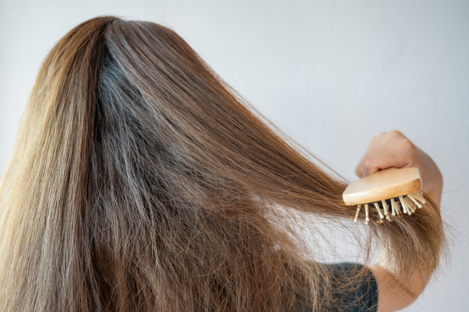 9 Genius Ways to Tame Frizzy Hair